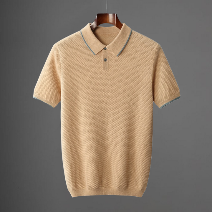 Beige knit polo shirt with blue-trimmed collar and button placket