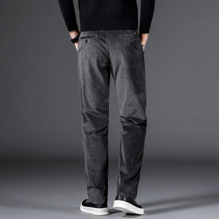 Medium-waist corduroy pants in dark gray with front pockets and belt loops