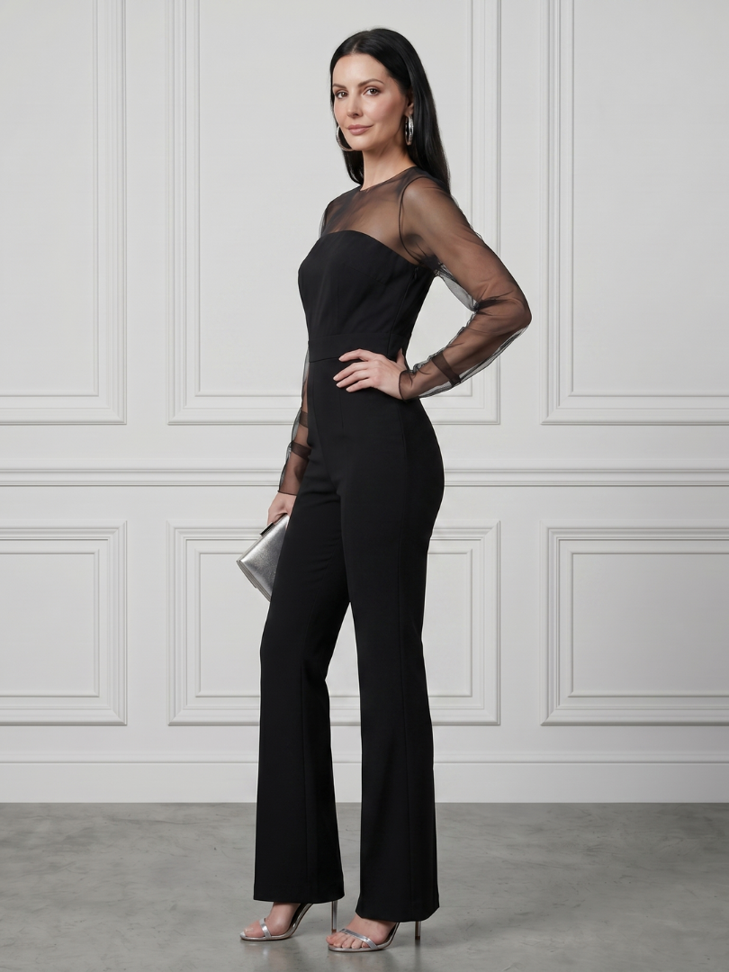 Black sheer-sleeve jumpsuit with straight neckline and wide-leg pants, side view