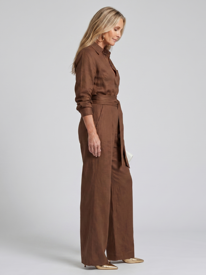 Brown tie-waist jumpsuit, side view, long sleeves and wide legs