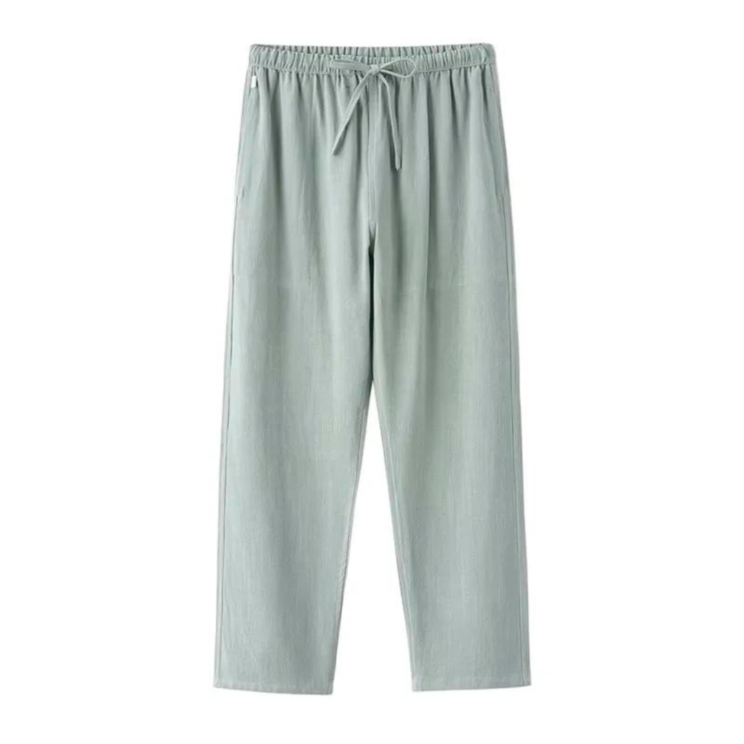 Light green linen pants with elastic waistband and tie drawstring, relaxed straight legs