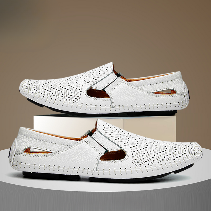 White perforated slip-on sandals with cut-out side panels and brown collar trim