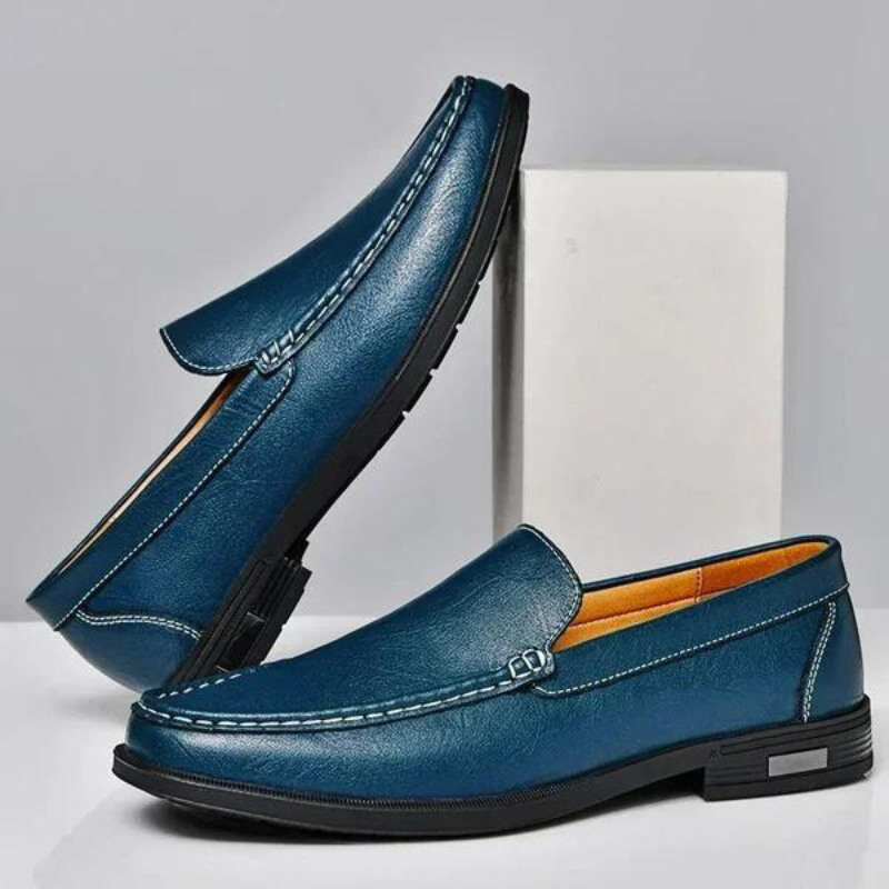 Blue leather penny loafers with metal bit and stitched moc-toe, dark rubber sole