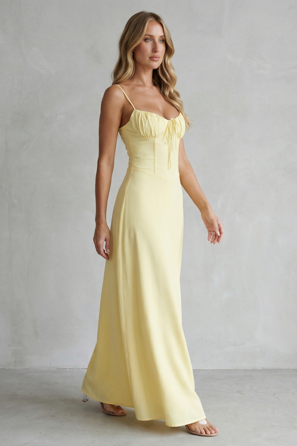 Yellow corset maxi dress with sweetheart neckline, thin straps, and gathered bodice