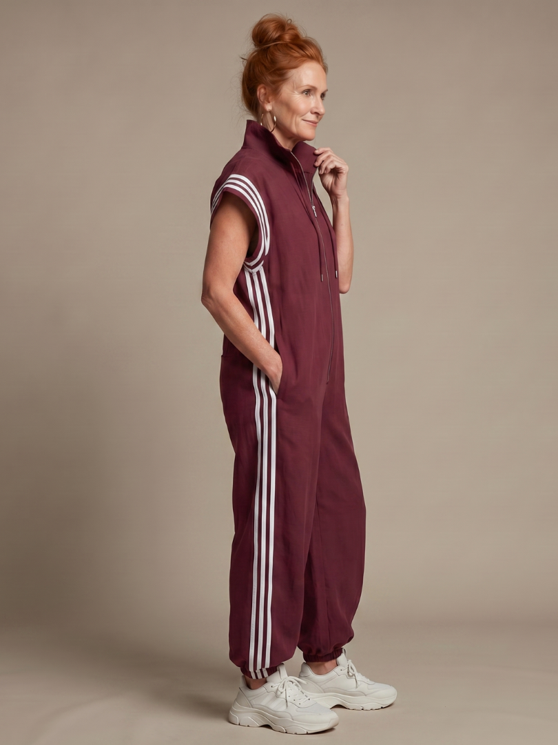 Women’s sleeveless zip-front jumpsuit, maroon with white striped sleeves and leg side stripes