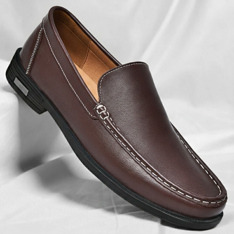 Brown leather penny loafer with metal bar detail and stitched moc toe, rubber sole