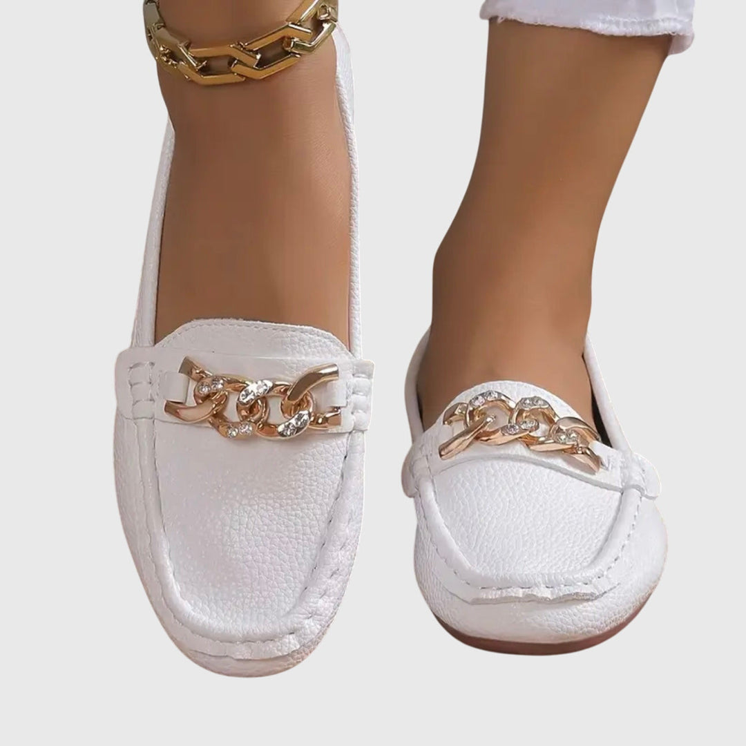 White chain loafers with gold-tone front chain accent and stitched moc-toe