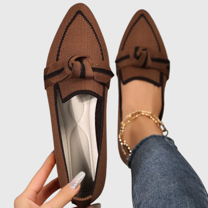 Brown knit loafer shoes with bow strap and contrast lining.