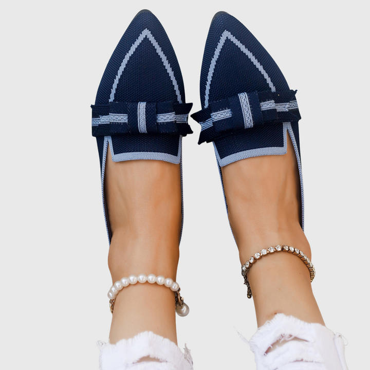 Royal blue pointed toe bow flats with striped bow and white edging