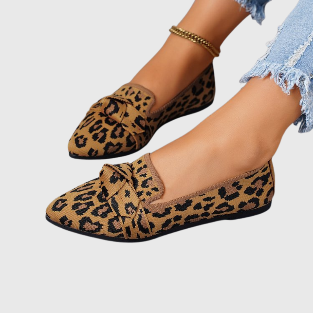 Leopard print knot flats in tan with black spots, knotted vamp, low flat sole