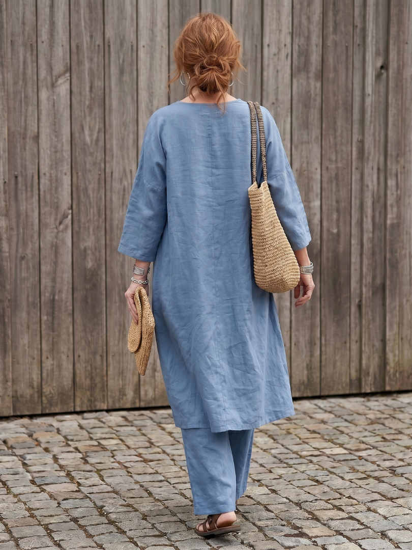 Blue linen two-piece set back view with elbow-length sleeves and straight wide-leg pants.