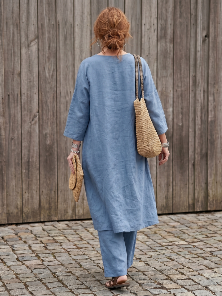Blue linen two-piece set back view with elbow-length sleeves and straight wide-leg pants.