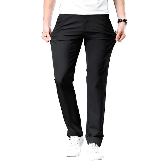 Black chino pants with belt loops, slant front pockets, and tapered trouser legs.