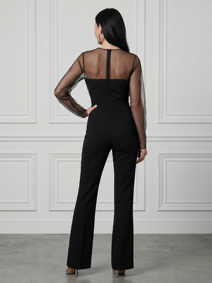 Black sheer-sleeve jumpsuit with open-back design and wide-leg pants, back view
