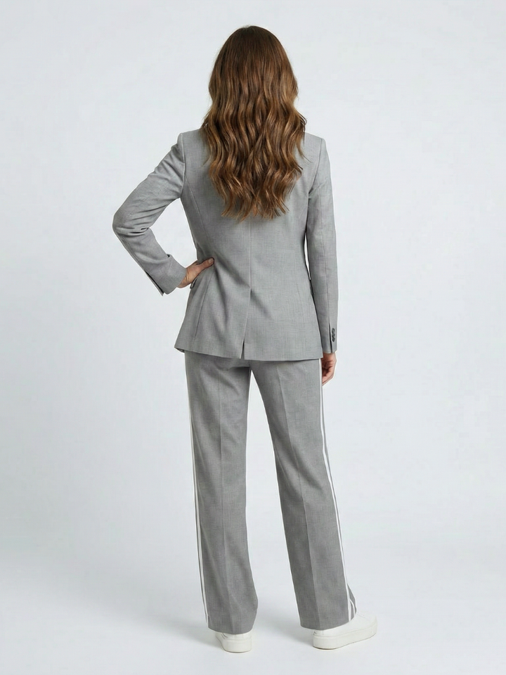 Gray women's blazer set back view: blazer and wide-leg trousers with side stripe