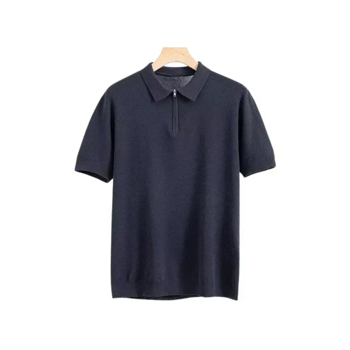Navy blue zip polo shirt with short sleeves, polo collar, and front quarter zip