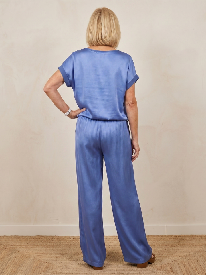 Women’s blue two-piece set back view: short-sleeve top and wide-leg drawstring pants.