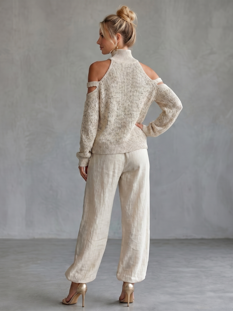 Women’s cutout sleeve knit set, back view of light beige sweater with drawstring wide-leg pants