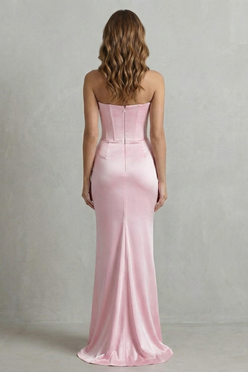 Baby pink strapless corset maxi dress with sleeveless back and vertical seams
