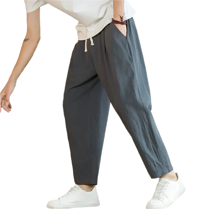 Dark gray cotton pants with drawstring waist, relaxed tapered leg, ankle length