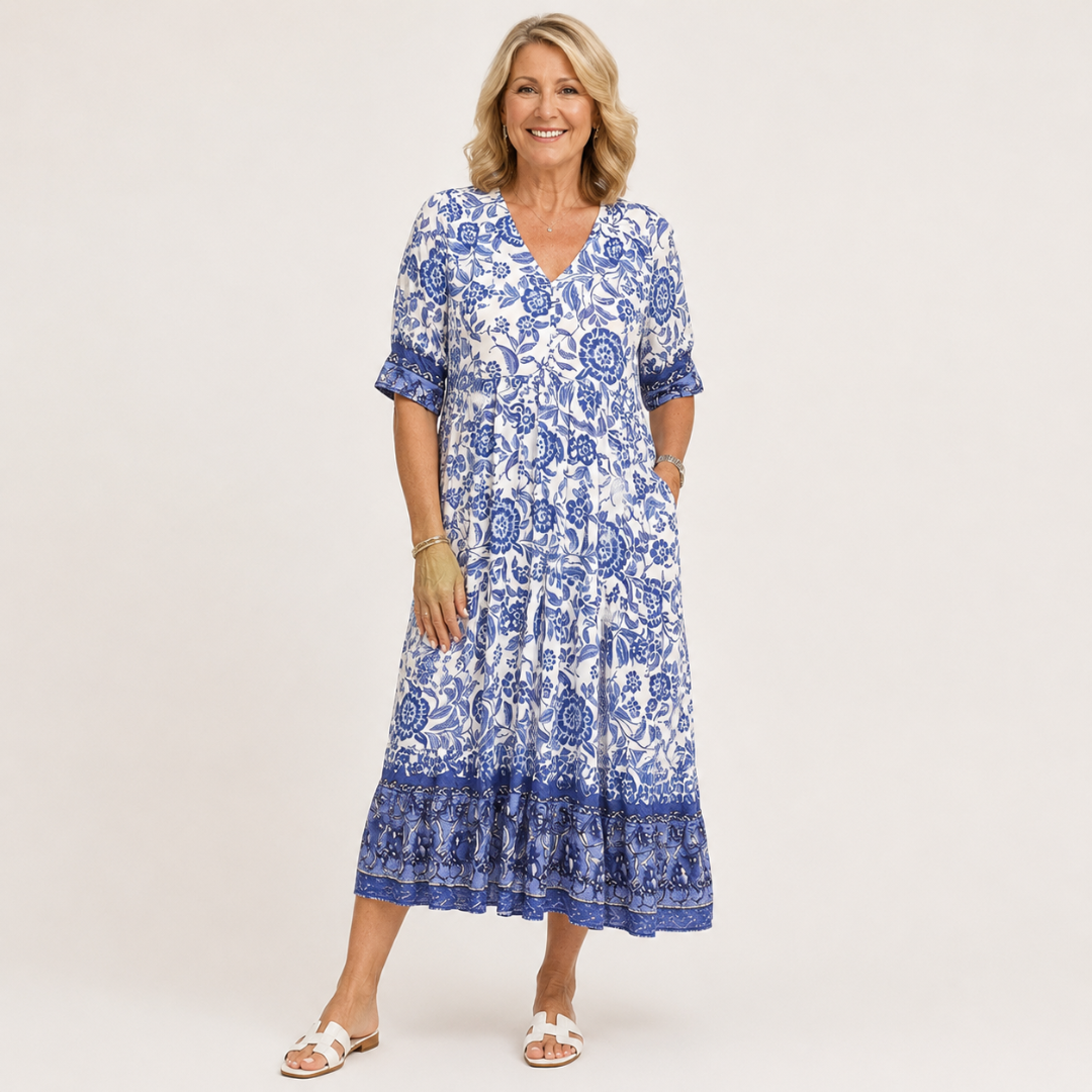 Blue floral V-neck tiered midi dress with short sleeves and layered ruffle hem