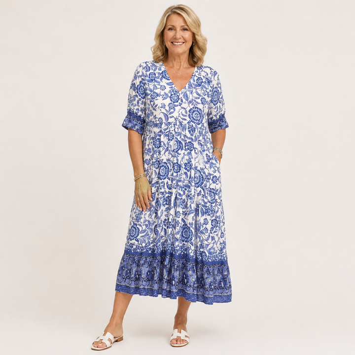 Blue floral V-neck tiered midi dress with short sleeves and layered ruffle hem
