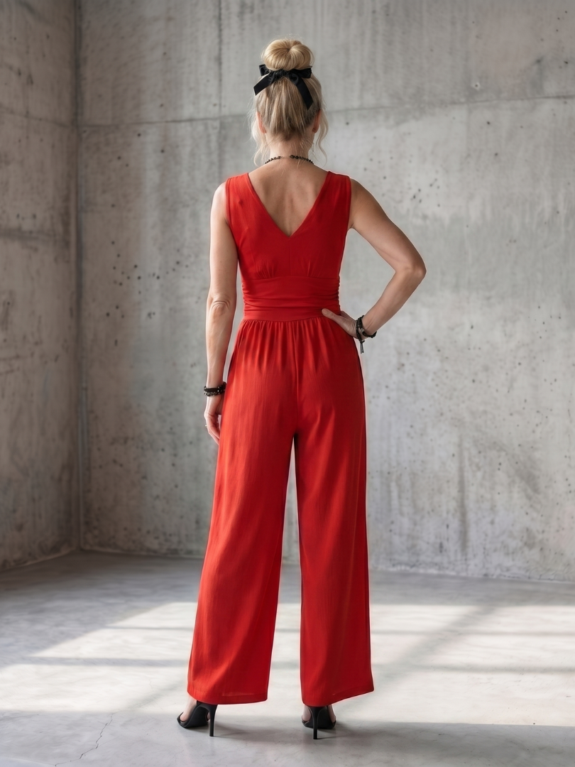 Red twist-front sleeveless jumpsuit with open back and wide-leg trousers