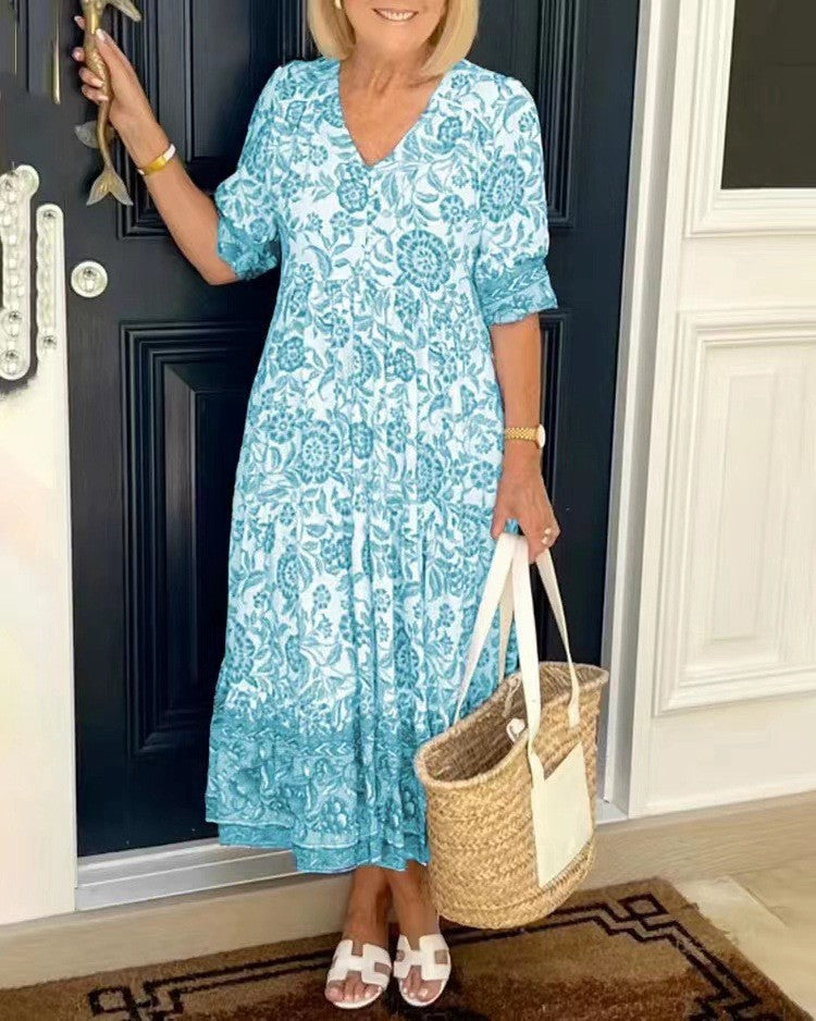 Sky blue floral V-neck tiered midi dress with short sleeves and ruffled layered hem