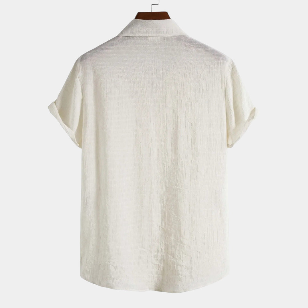 Light beige short-sleeve summer shirt, back view with curved hem