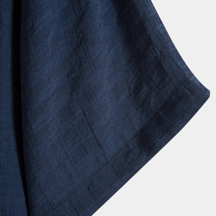 Navy woven summer shirt fabric texture with subtle diagonal pattern