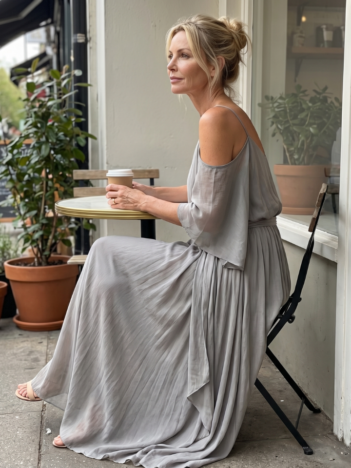 Gray cold-shoulder maxi dress with draped sleeves and pleated, tiered skirt