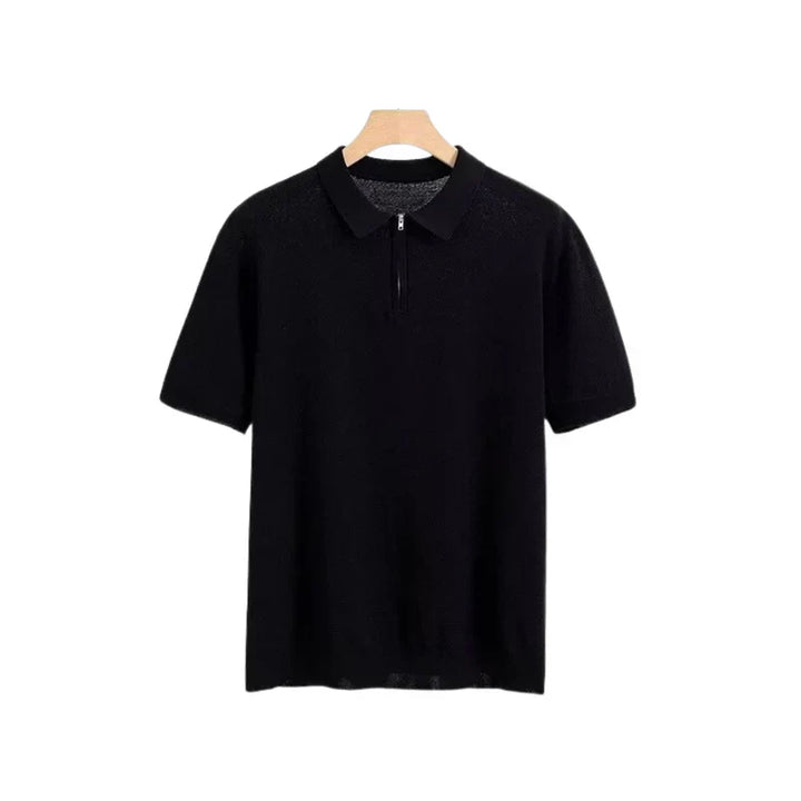 Black zip polo shirt with short sleeves, polo collar, and front quarter zip