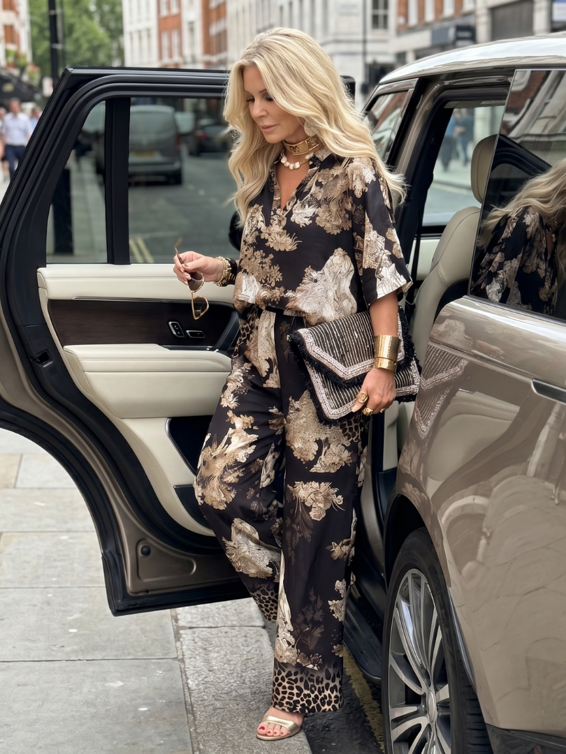 Floral printed wide-leg pants set, black with beige tones, standing front view