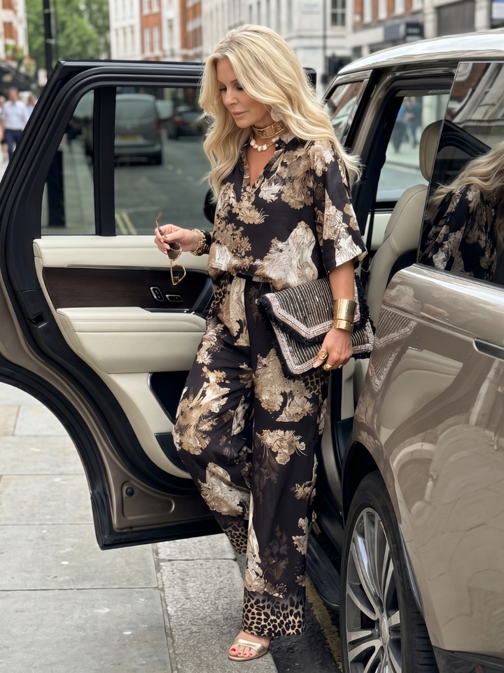 Floral printed wide-leg pants set, black with beige tones, standing front view