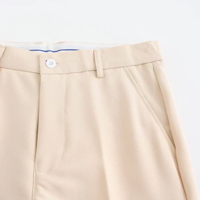 Nude stretch pants with button closure and flat front waistband
