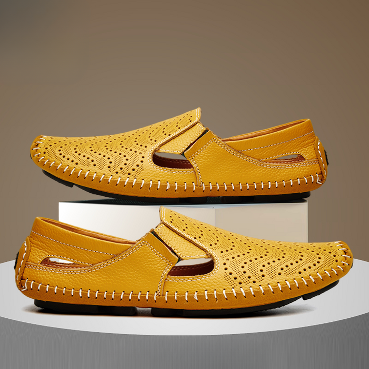 Yellow perforated slip-on sandals on pedestal, moc-style upper with stitched edge