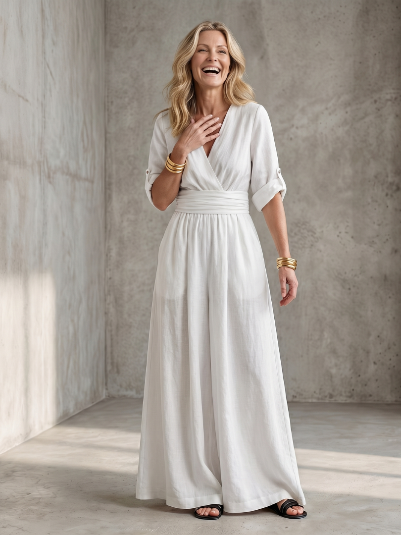 White wide-leg wrap jumpsuit, V-neck with tie waist and gathered skirt