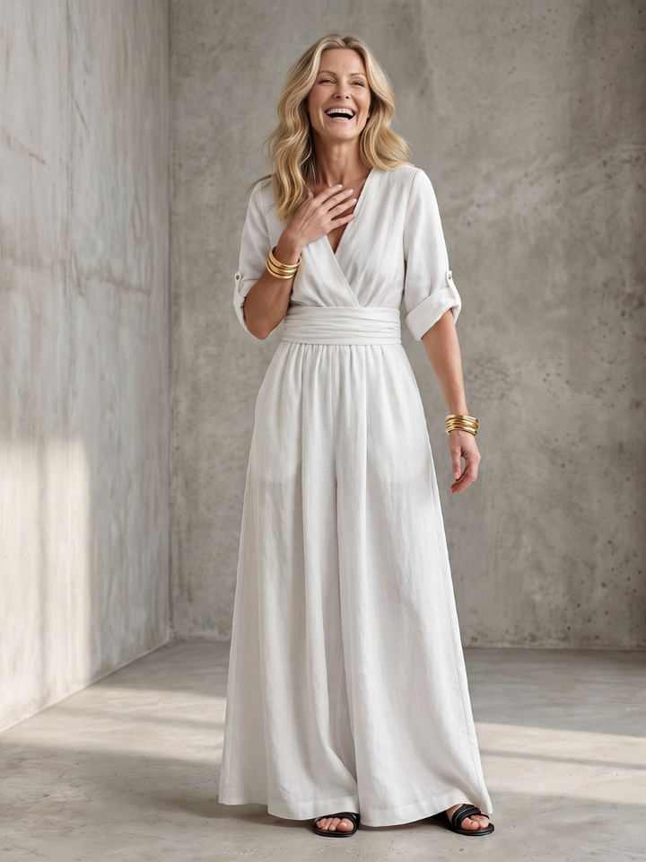 White wide-leg wrap jumpsuit, V-neck with tie waist and gathered skirt