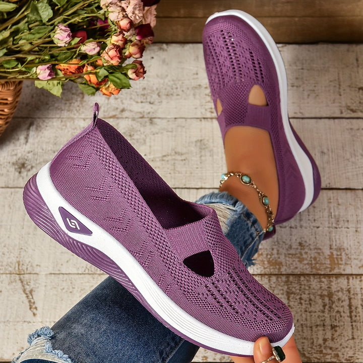 Purple knit slip-on sneakers with white sole and toe cutout detail