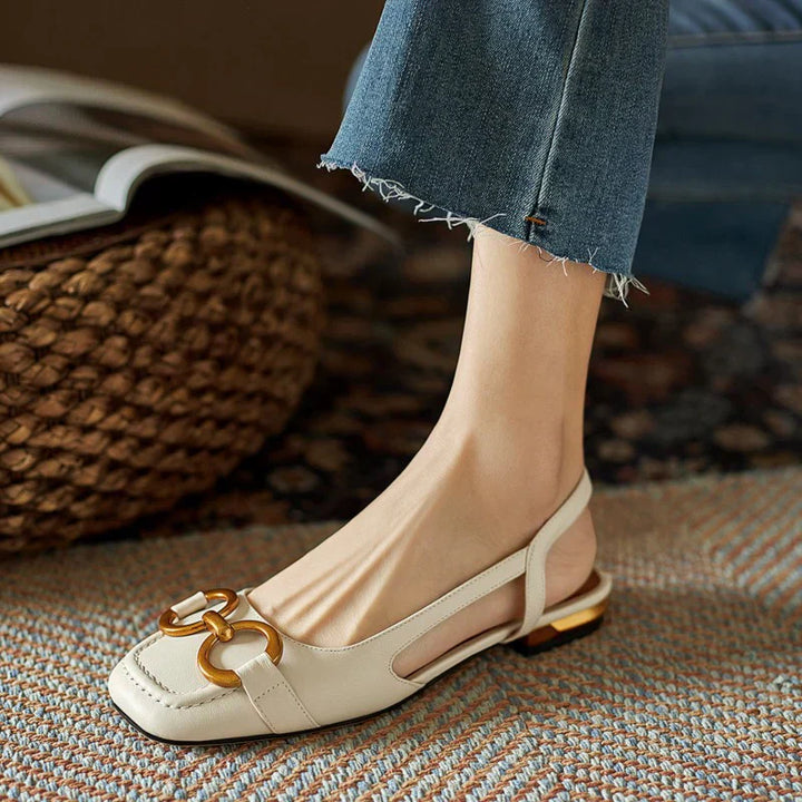 Women’s slingback flats in light beige leather with buckle detail and low block heel