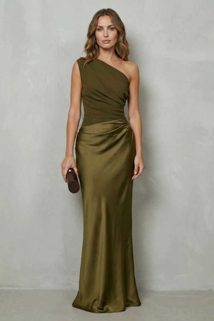 Dark green one-shoulder satin evening gown with diagonal drape and gathered waist