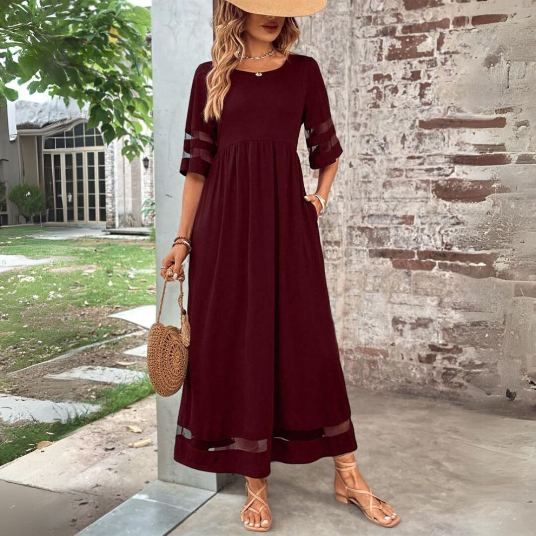 Red midi dress with gathered waist, sheer cutout sleeves, and mesh hem panel.
