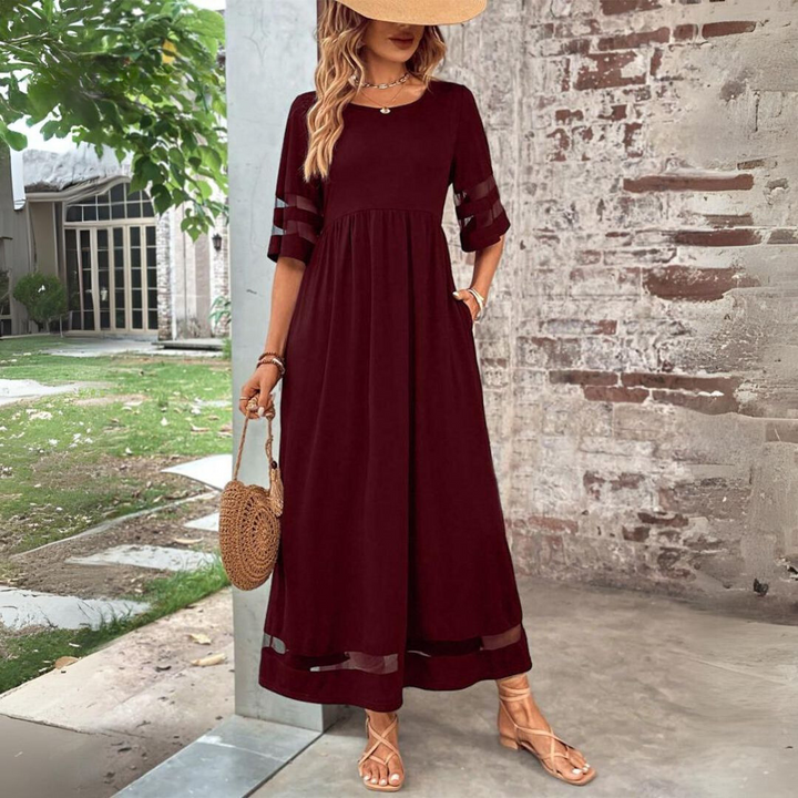 Red midi dress with gathered waist, sheer cutout sleeves, and mesh hem panel.