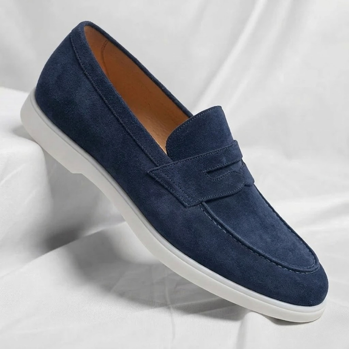 Men's suede loafers in navy blue with slip-on strap and white rubber sole