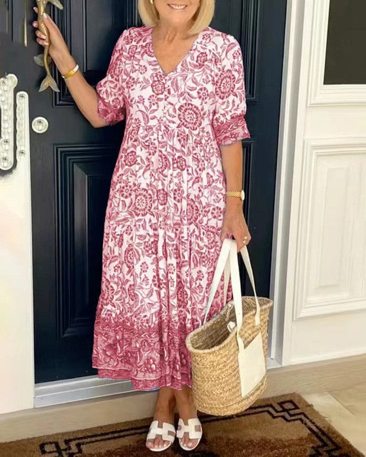 Pink floral V-neck tiered midi dress with short sleeves and gathered skirt tiers