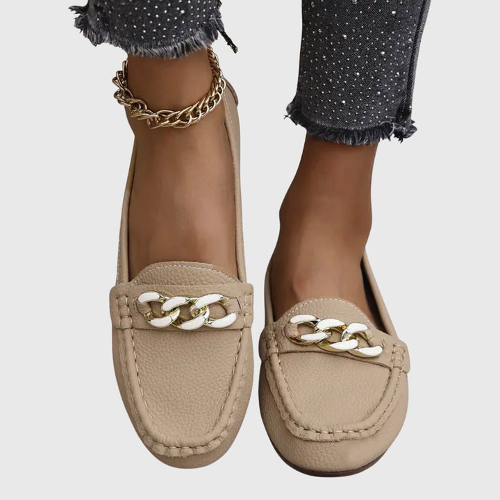 Beige chain loafers with braided chain detail and stitched round moc-toe