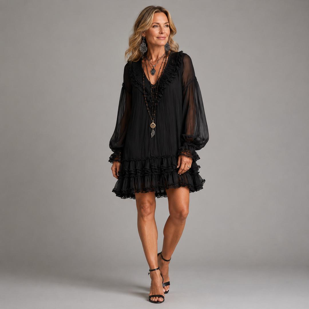 Black mini dress with sheer puff sleeves and tiered ruffle hem, V-neck bodice