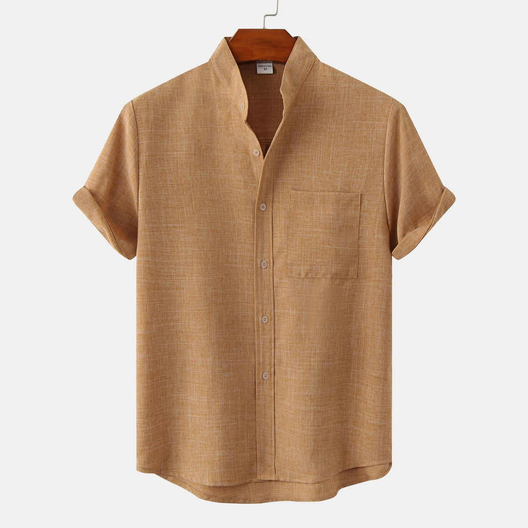 Tan solid cotton button-up shirt with short sleeves and button front.
