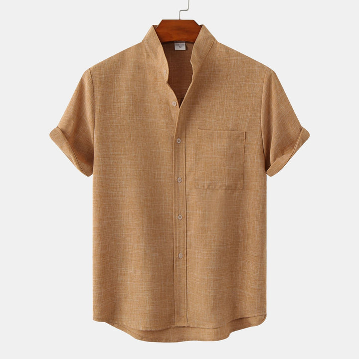 Tan solid cotton button-up shirt with short sleeves and button front.