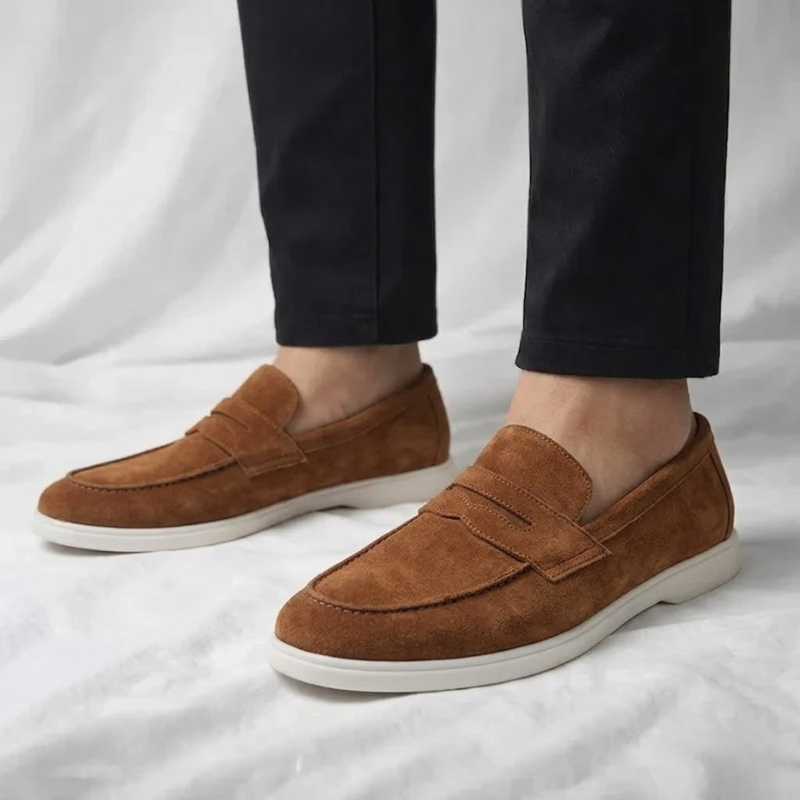 Men's suede loafers in warm brown with slip-on strap and white rubber sole
